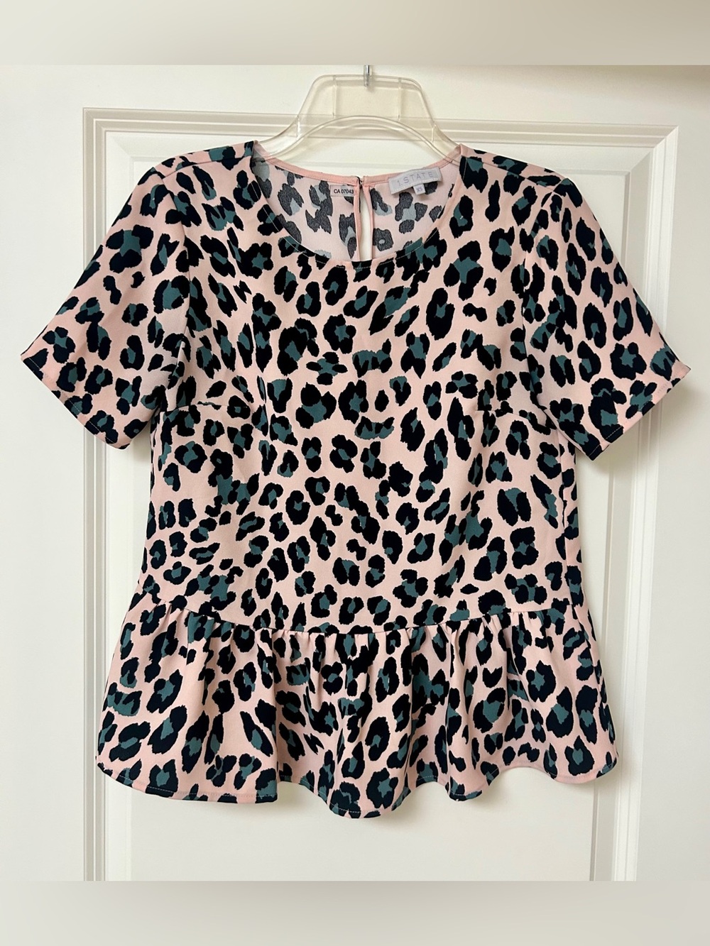 1. State Pink Leopard Print Short Sleeve Peplum Top